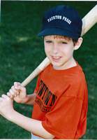Adam (age 9) posing with a baseball bat. Taken in 2001 for a baseball card listing his team as 'Taunton Press', position 'outfield', bats and throws 'right', height '4ft6' and weight 57.