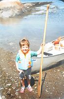 Adam posing in front of a boat, found in a photo frame. Source: Lanza Home Backup Scene 489.