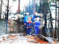 Adam (bottom left) with his brother (top-left) and some friends photographed in a forest. Found in a photo frame opposite Nancy's bad.